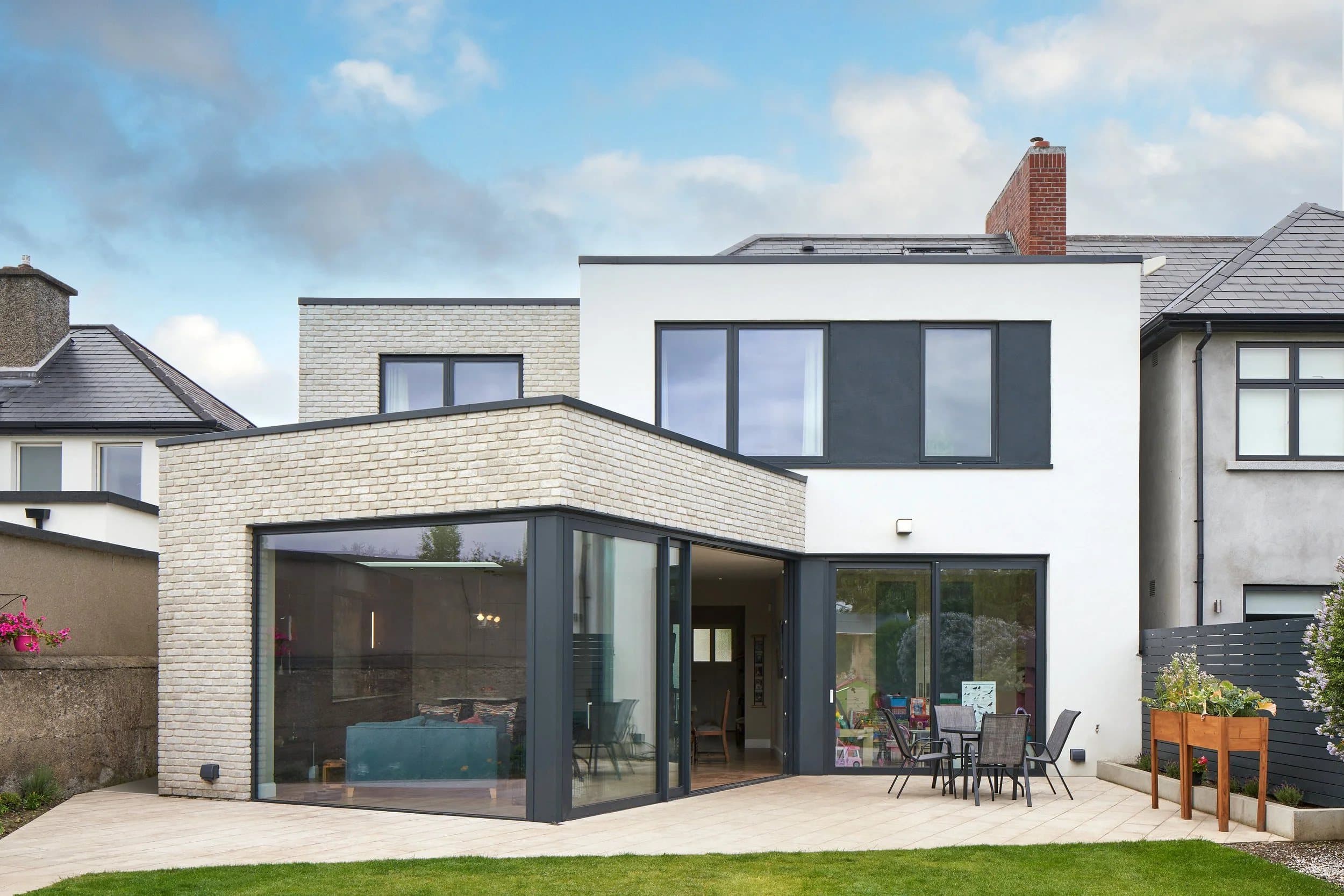 A renovated brick home with a contemporary extension